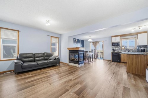218 Tarawood Place Ne, Calgary, AB - Indoor Photo Showing Living Room With Fireplace