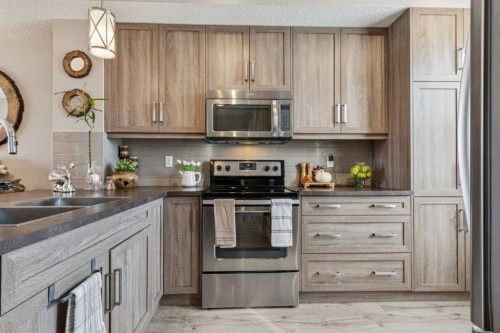 61 Nolancrest Gate Nw, Calgary, AB - Indoor Photo Showing Kitchen With Stainless Steel Kitchen With Double Sink With Upgraded Kitchen