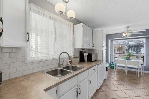 96 Abberfield Crescent Ne, Calgary, AB - Indoor Photo Showing Kitchen With Double Sink