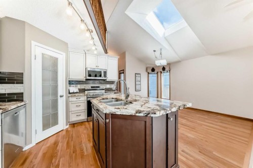 110 Somerglen Road Sw, Calgary, AB - Indoor Photo Showing Kitchen With Double Sink With Upgraded Kitchen