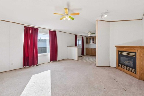 1909 29 Avenue, Nanton, AB - Indoor With Fireplace