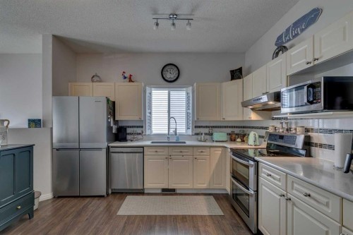 271 Tuscany Valley Drive Nw, Calgary, AB - Indoor Photo Showing Kitchen With Stainless Steel Kitchen