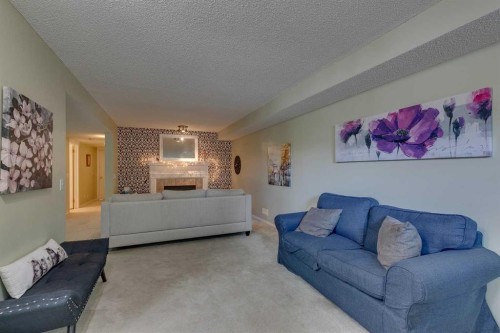 271 Tuscany Valley Drive Nw, Calgary, AB - Indoor Photo Showing Living Room