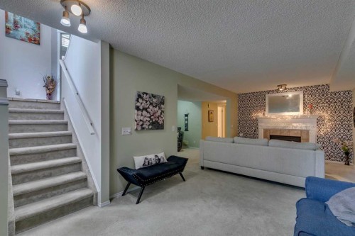 271 Tuscany Valley Drive Nw, Calgary, AB - Indoor With Fireplace