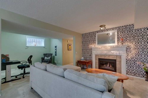 271 Tuscany Valley Drive Nw, Calgary, AB - Indoor With Fireplace