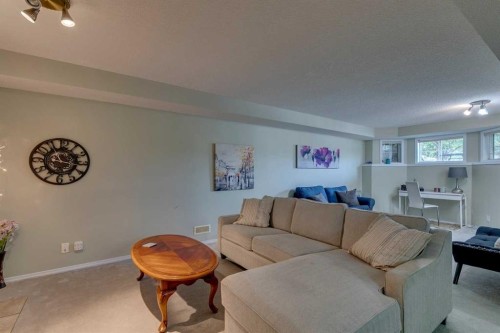 271 Tuscany Valley Drive Nw, Calgary, AB - Indoor Photo Showing Living Room