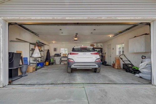 271 Tuscany Valley Drive Nw, Calgary, AB - Indoor Photo Showing Garage