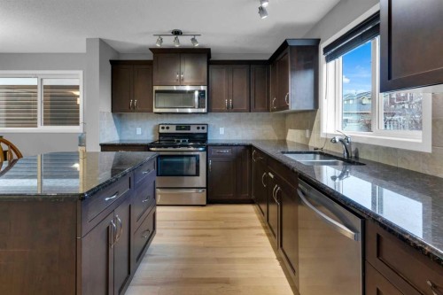 367 Fireside Place, Cochrane, AB - Indoor Photo Showing Kitchen With Stainless Steel Kitchen With Double Sink
