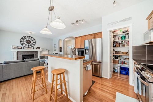 936 Copperfield Boulevard Se, Calgary, AB - Indoor Photo Showing Kitchen With Fireplace