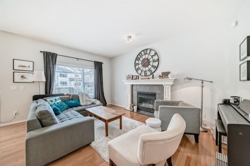 936 Copperfield Boulevard Se, Calgary, AB - Indoor Photo Showing Living Room With Fireplace