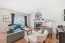 936 Copperfield Boulevard Se, Calgary, AB  - Indoor Photo Showing Living Room With Fireplace 