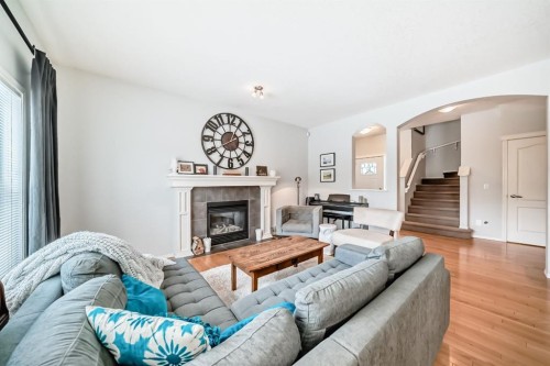 936 Copperfield Boulevard Se, Calgary, AB - Indoor Photo Showing Living Room With Fireplace