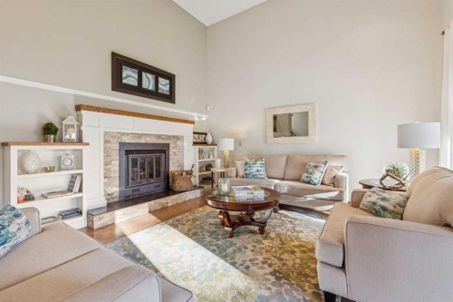 6 Glenbrook Crescent, Cochrane, AB - Indoor Photo Showing Living Room With Fireplace