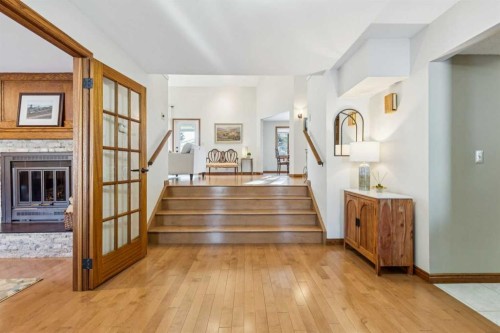 6 Glenbrook Crescent, Cochrane, AB - Indoor Photo Showing Other Room With Fireplace