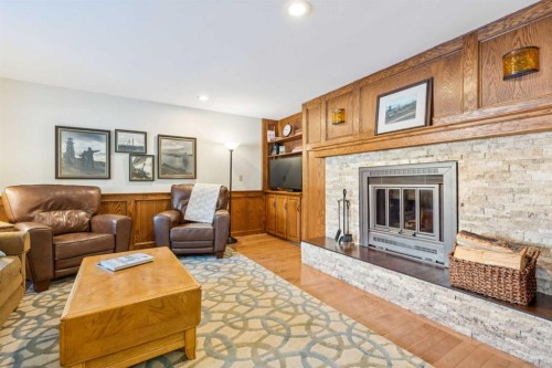 6 Glenbrook Crescent, Cochrane, AB - Indoor Photo Showing Living Room With Fireplace