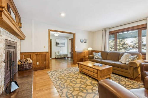 6 Glenbrook Crescent, Cochrane, AB - Indoor Photo Showing Living Room With Fireplace