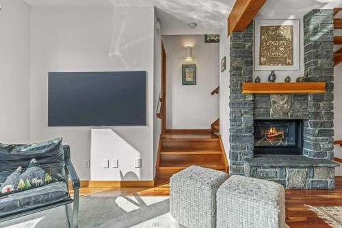 4-511 6Th Avenue, Canmore, AB - Indoor Photo Showing Living Room With Fireplace