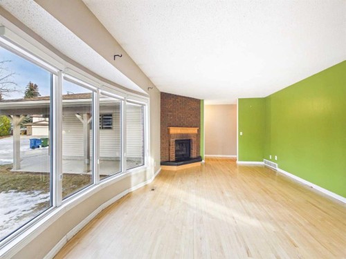 503 Dalcastle Mews Nw, Calgary, AB - Indoor With Fireplace