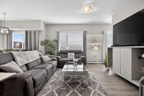 204-4150 Seton Drive Se, Calgary, AB - Indoor Photo Showing Living Room