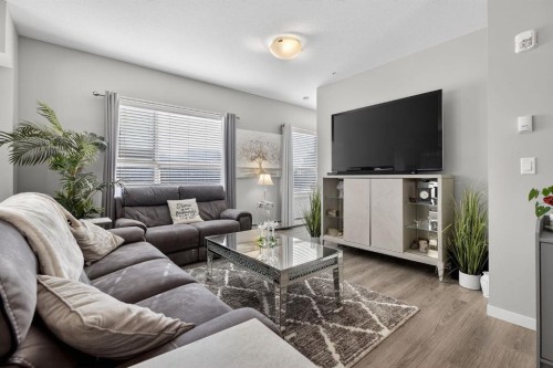 204-4150 Seton Drive Se, Calgary, AB - Indoor Photo Showing Living Room