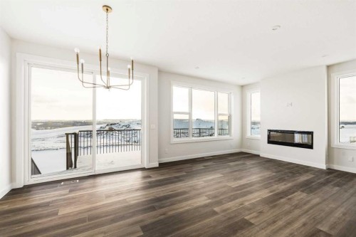 27 Setonvista Grove Se, Calgary, AB - Indoor Photo Showing Living Room With Fireplace