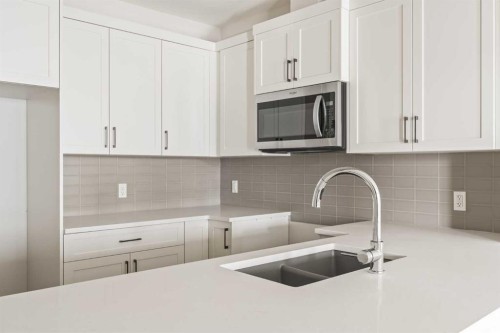 27 Setonvista Grove Se, Calgary, AB - Indoor Photo Showing Kitchen With Double Sink With Upgraded Kitchen
