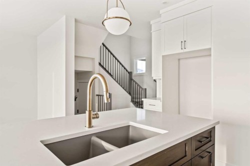 27 Setonvista Grove Se, Calgary, AB - Indoor Photo Showing Kitchen With Double Sink