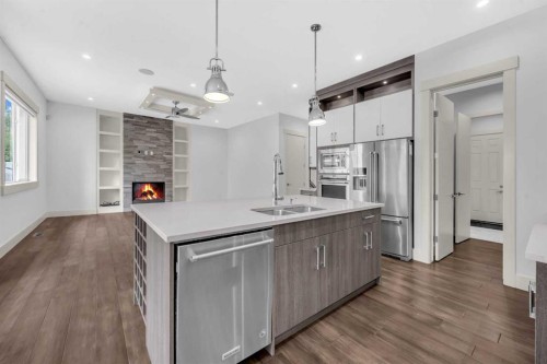 127 Evansview Road Nw, Calgary, AB - Indoor Photo Showing Kitchen With Fireplace With Double Sink With Upgraded Kitchen