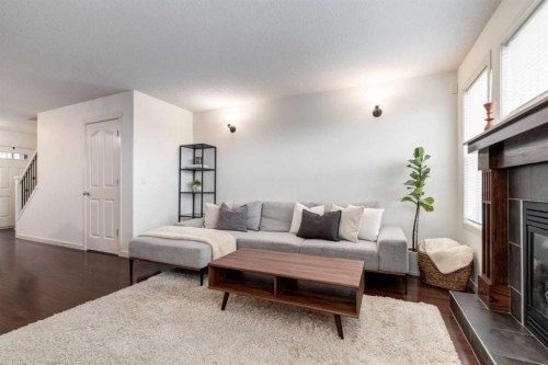 5 Cranford Place Se, Calgary, AB - Indoor Photo Showing Living Room With Fireplace