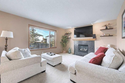 105 Citadel Crest Park Nw, Calgary, AB - Indoor Photo Showing Living Room With Fireplace
