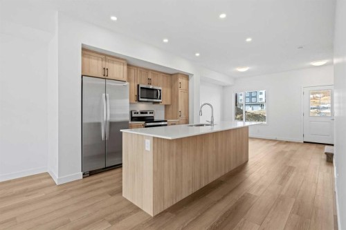 1007-25 Wildwoods Court Sw, Airdrie, AB - Indoor Photo Showing Kitchen With Stainless Steel Kitchen With Upgraded Kitchen