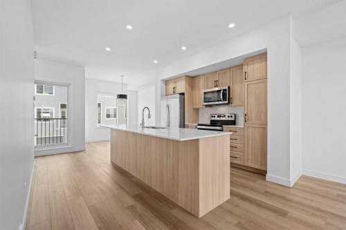 1007-25 Wildwoods Court Sw, Airdrie, AB - Indoor Photo Showing Kitchen With Stainless Steel Kitchen With Upgraded Kitchen