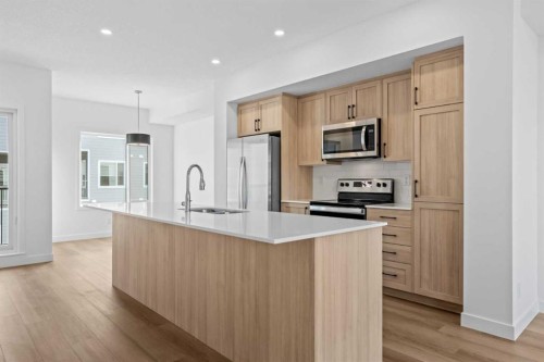 1007-25 Wildwoods Court Sw, Airdrie, AB - Indoor Photo Showing Kitchen With Stainless Steel Kitchen With Upgraded Kitchen