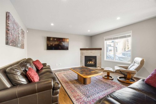 34 Edgeridge Mews Nw, Calgary, AB - Indoor Photo Showing Living Room With Fireplace