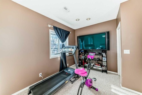 116 Hidden Creek Rise Nw, Calgary, AB - Indoor Photo Showing Gym Room