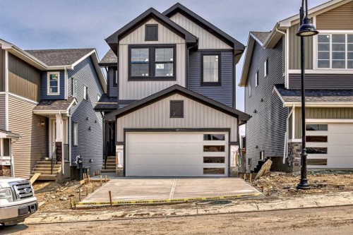 4 Topaz Place, Cochrane, AB - Outdoor With Facade