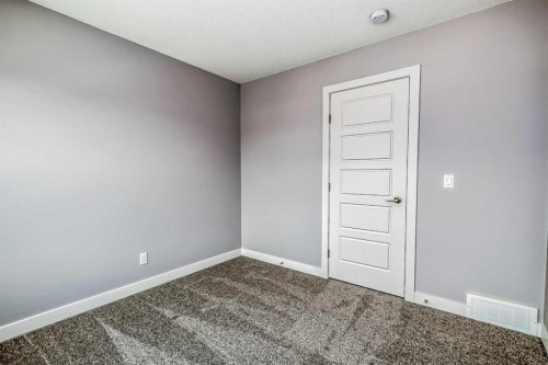 4 Topaz Place, Cochrane, AB - Indoor Photo Showing Other Room
