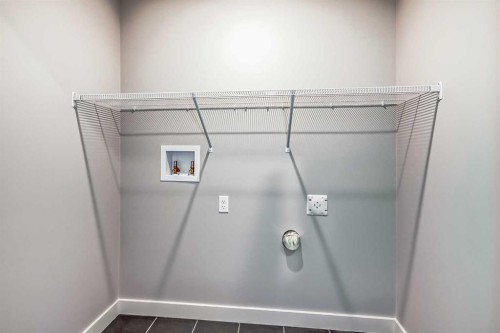 4 Topaz Place, Cochrane, AB - Indoor With Storage