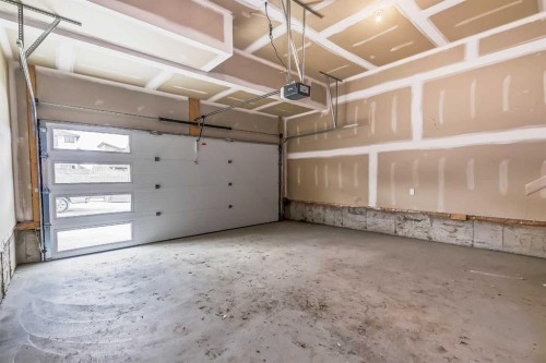 4 Topaz Place, Cochrane, AB - Indoor Photo Showing Garage
