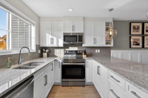 317 Legacy Boulevard Se, Calgary, AB - Indoor Photo Showing Kitchen With Double Sink With Upgraded Kitchen