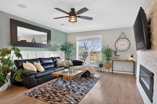 317 Legacy Boulevard Se, Calgary, AB - Indoor Photo Showing Living Room With Fireplace