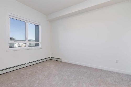 1414-520 Reynolds Avenue Sw, Airdrie, AB - Indoor Photo Showing Other Room