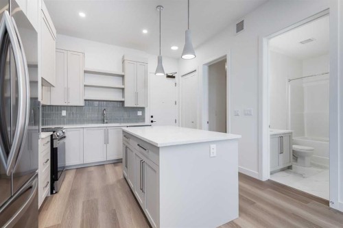 1414-520 Reynolds Avenue Sw, Airdrie, AB - Indoor Photo Showing Kitchen With Upgraded Kitchen