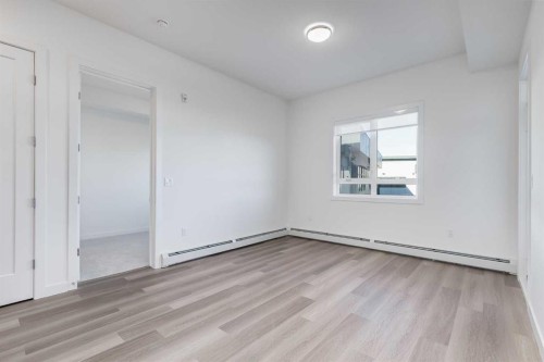1414-520 Reynolds Avenue Sw, Airdrie, AB - Indoor Photo Showing Other Room