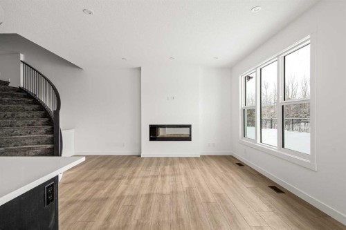 71 Silver Spruce Grove Sw, Calgary, AB - Indoor With Fireplace