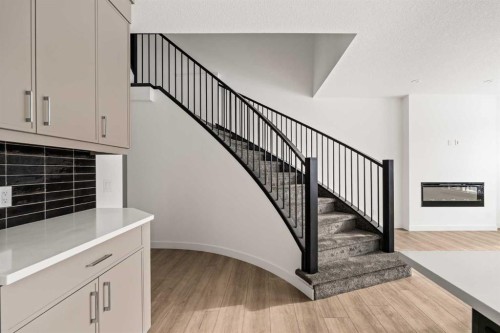 71 Silver Spruce Grove Sw, Calgary, AB - Indoor Photo Showing Other Room With Fireplace