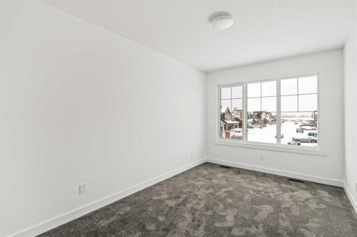 71 Silver Spruce Grove Sw, Calgary, AB - Indoor Photo Showing Other Room