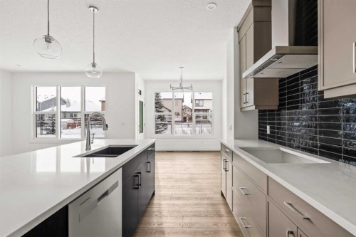 71 Silver Spruce Grove Sw, Calgary, AB - Indoor Photo Showing Kitchen With Double Sink With Upgraded Kitchen