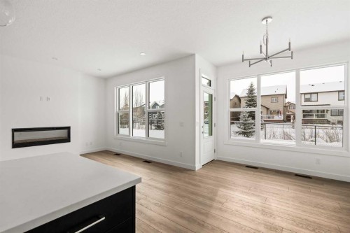 71 Silver Spruce Grove Sw, Calgary, AB - Indoor With Fireplace