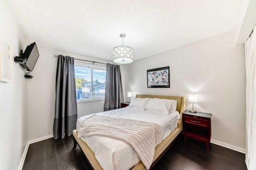 12 Taraglen Road Ne, Calgary, AB - Indoor Photo Showing Bedroom